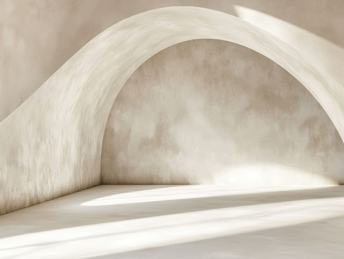 Interior wall with a rounded arch opening.